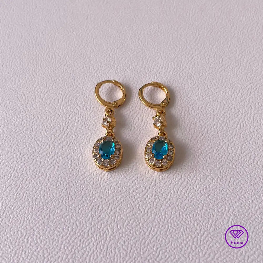 18K gold plated oval earrings with main blue cubic zirconia and small white topaz decoration