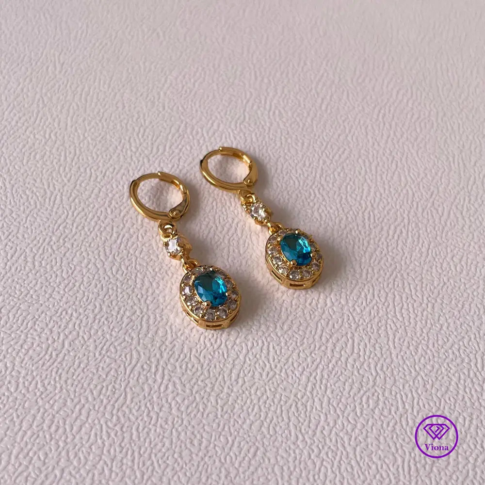 18K gold plated oval earrings with main blue cubic zirconia and small white topaz decoration