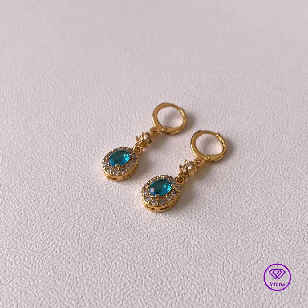 18K gold plated oval earrings with main blue cubic zirconia and small white topaz decoration