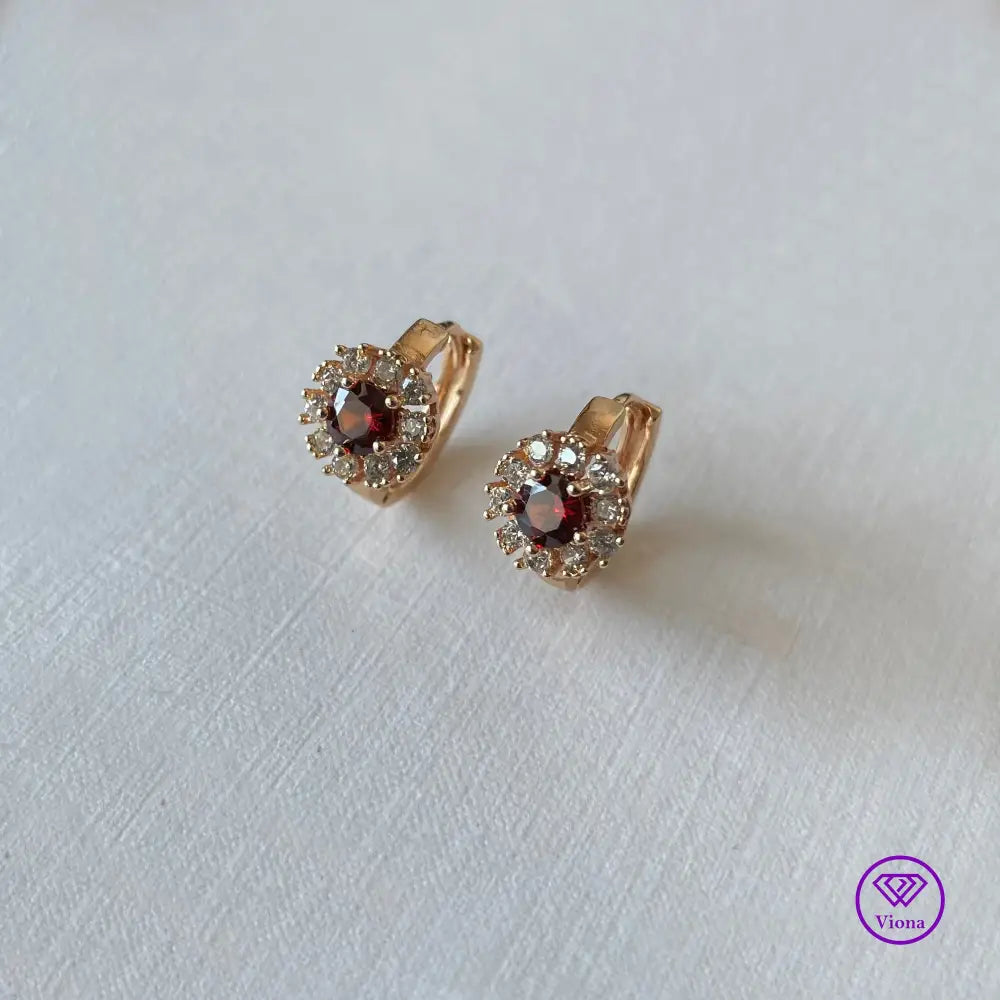 Gold-Filled Earrings with round ruby red Cubic Zirconia main stone and 10 white topaz