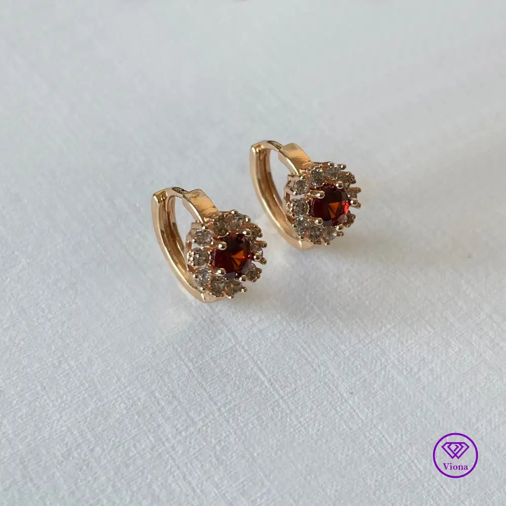 Gold-Filled Earrings with round ruby red Cubic Zirconia main stone and 10 white topaz