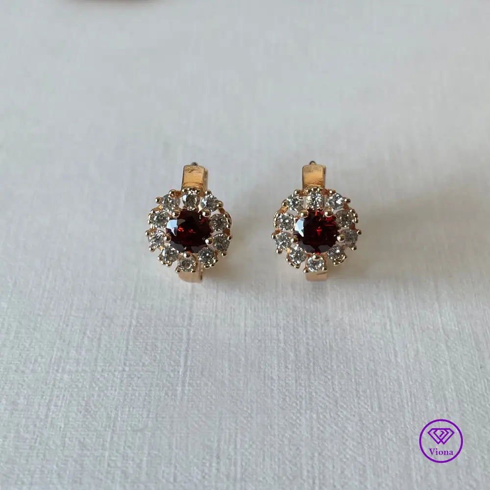 Gold-Filled Earrings with round ruby red Cubic Zirconia main stone and 10 white topaz