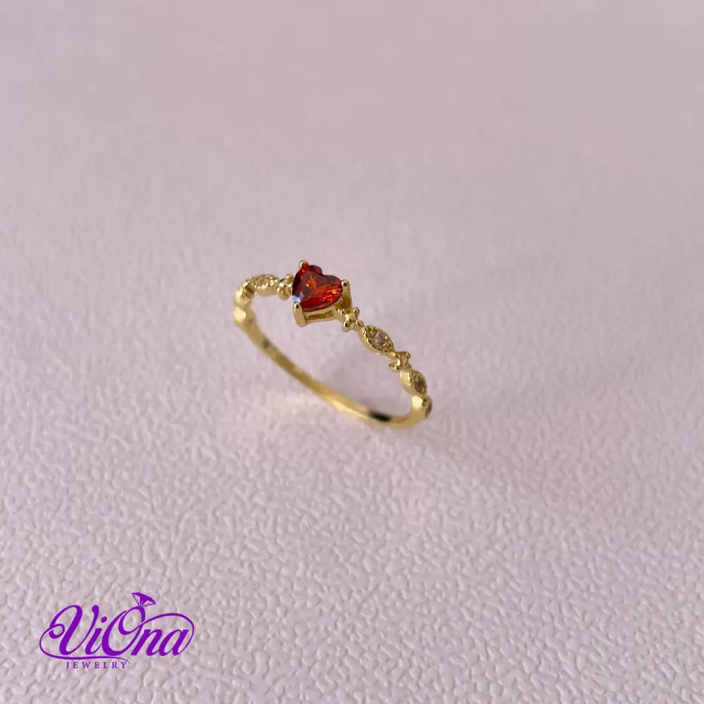 Gold Plated 925 Sterling silver ruby red heart ring with decorated topaz