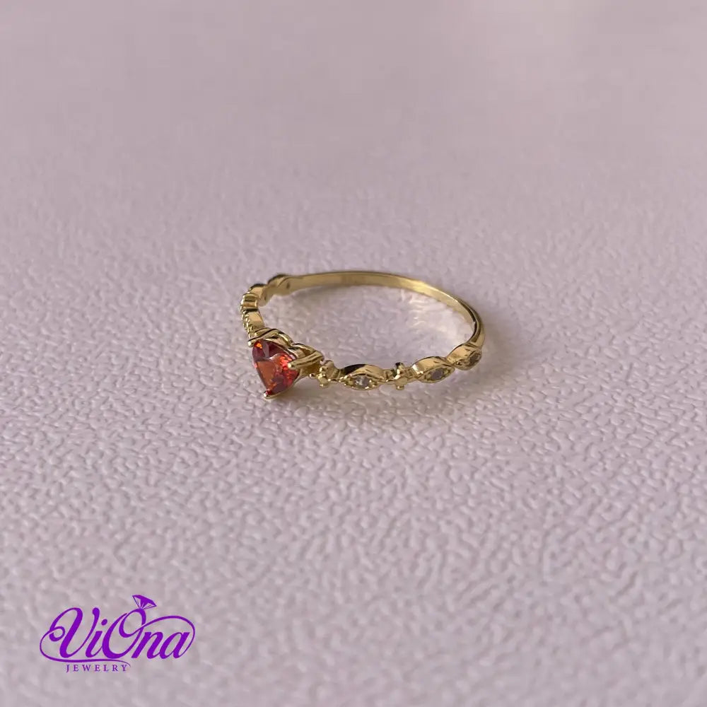 Gold Plated 925 Sterling silver ruby red heart ring with decorated topaz