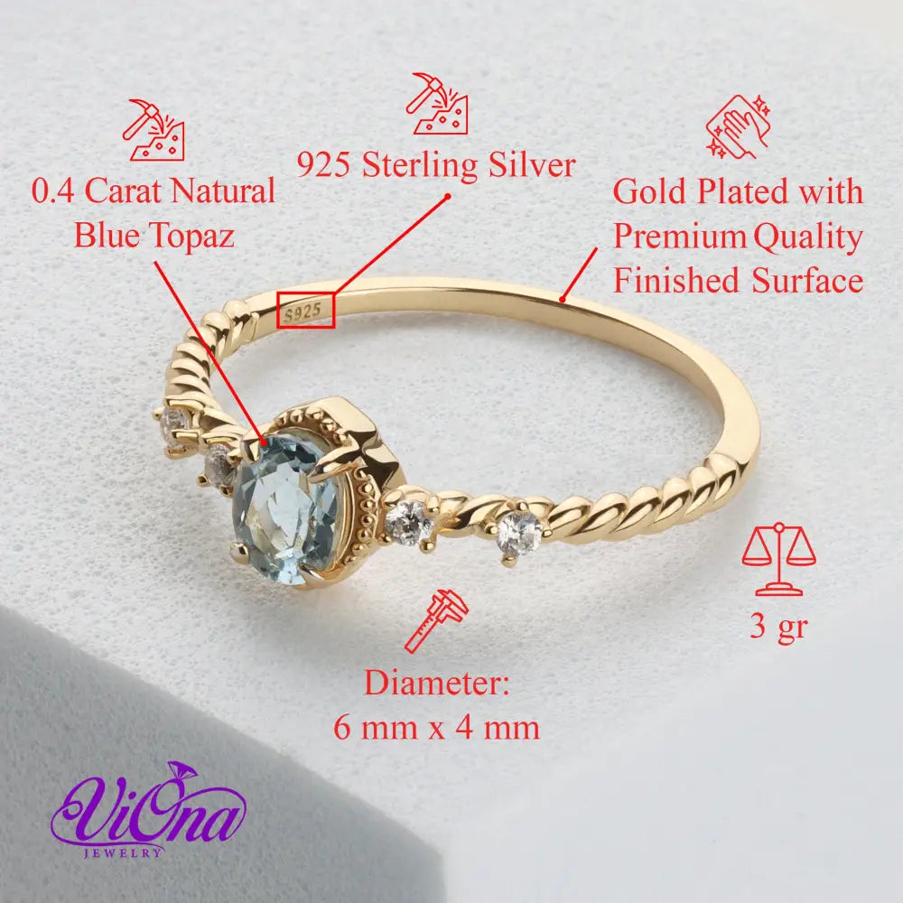 Oval Blue Topaz Gemstone Radiance: Gold-Plated 925 Sterling Silver Ring with 4 Side Stones and Intricate Rope Detailing