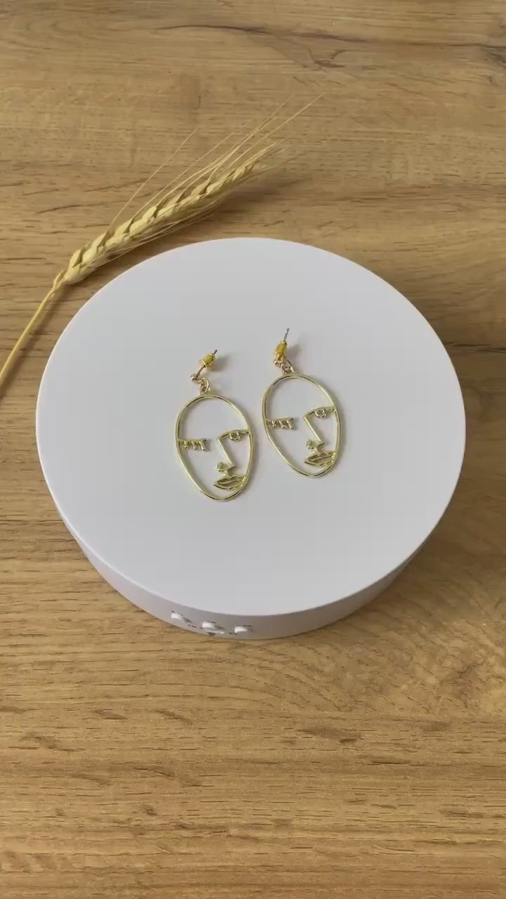 Winking girl, Hollow punk face dangle earrings in gold color