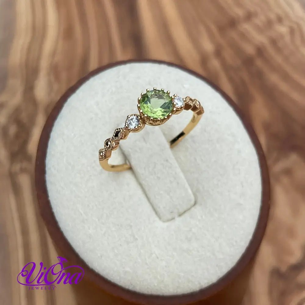 Real Peridot Ring, Round Cut in Gold Plated 925 Sterling Silver with Premium Quality Polished surface plus two CZ side stones