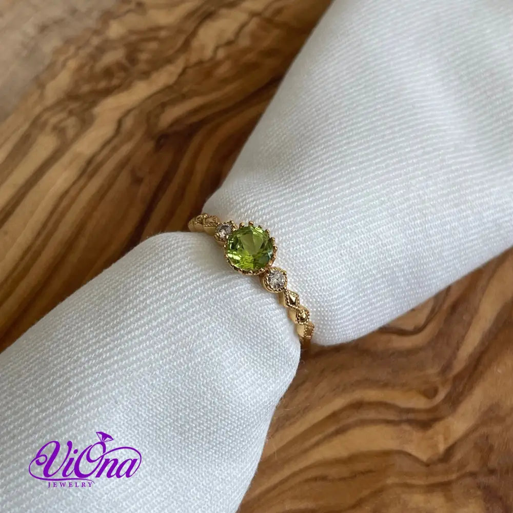 Real Peridot Ring, Round Cut in Gold Plated 925 Sterling Silver with Premium Quality Polished surface plus two CZ side stones