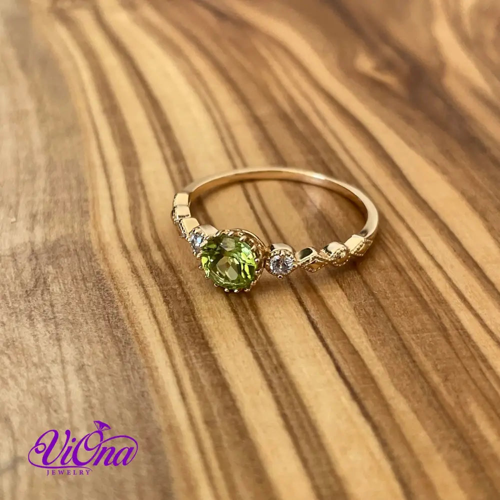 Real Peridot Ring, Round Cut in Gold Plated 925 Sterling Silver with Premium Quality Polished surface plus two CZ side stones