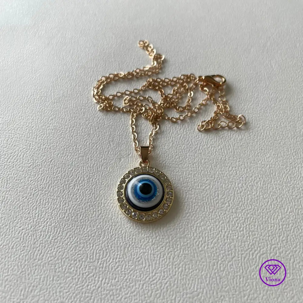 Round Evil Eye necklace, Gold frame with blue pendant