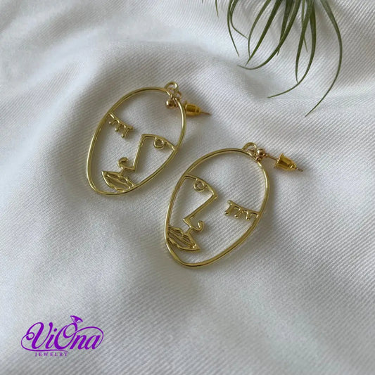 Winking girl, Hollow punk face dangle earrings in gold color