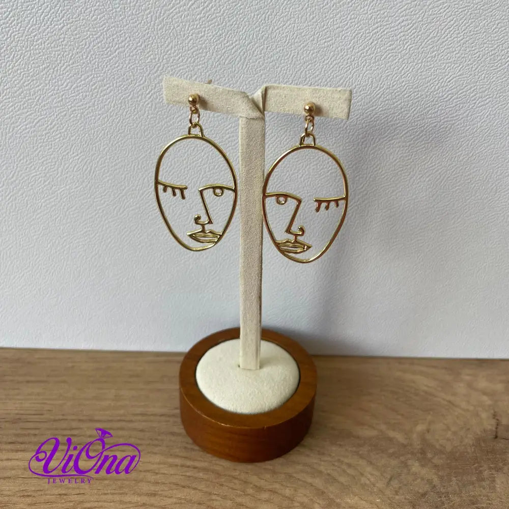 Winking girl, Hollow punk face dangle earrings in gold color