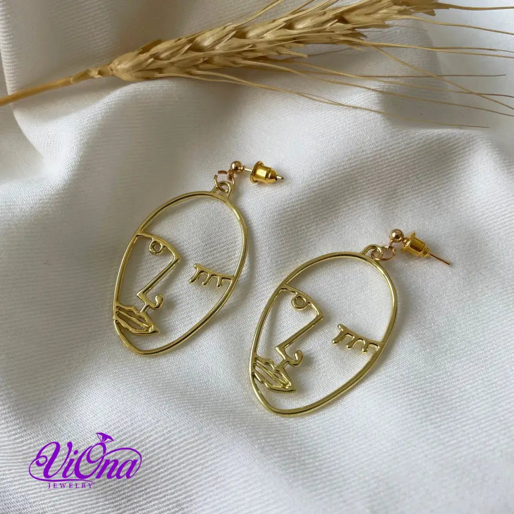 Winking girl, Hollow punk face dangle earrings in gold color