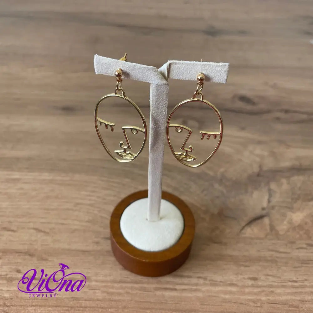 Winking girl, Hollow punk face dangle earrings in gold color